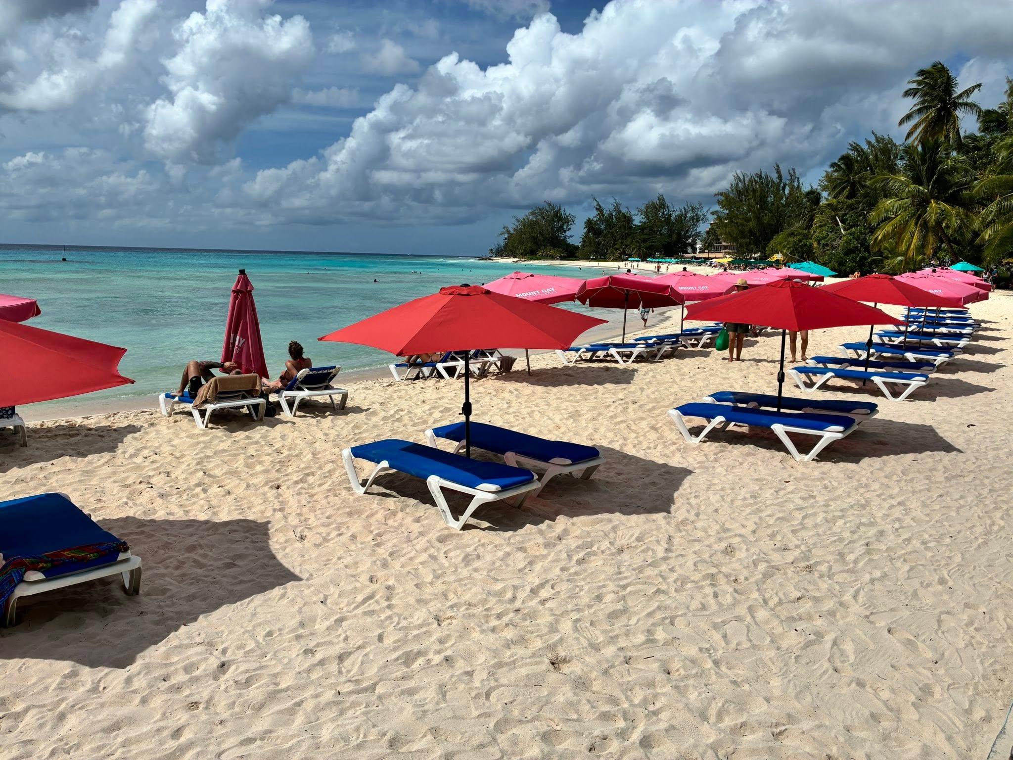 Accra Beach in Barbados with sun loungers beside the Caribbean Sea