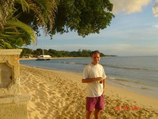 Chris Clayton on a beach in Barbados
