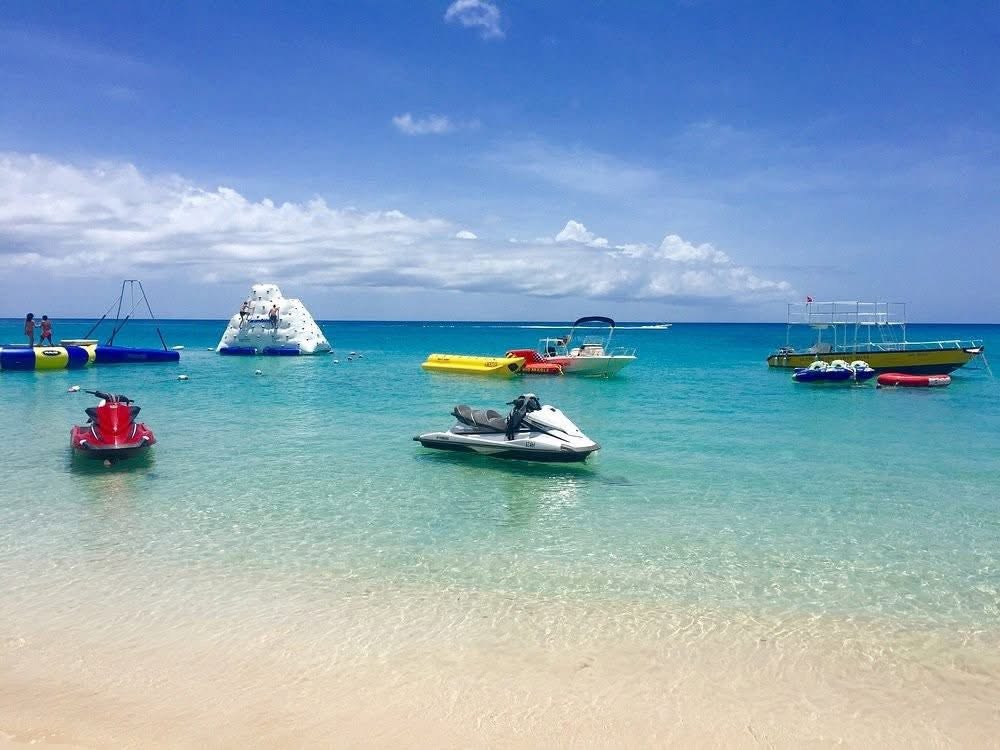 Jet skis and watersports on the sea at Mullins Beach Barbados