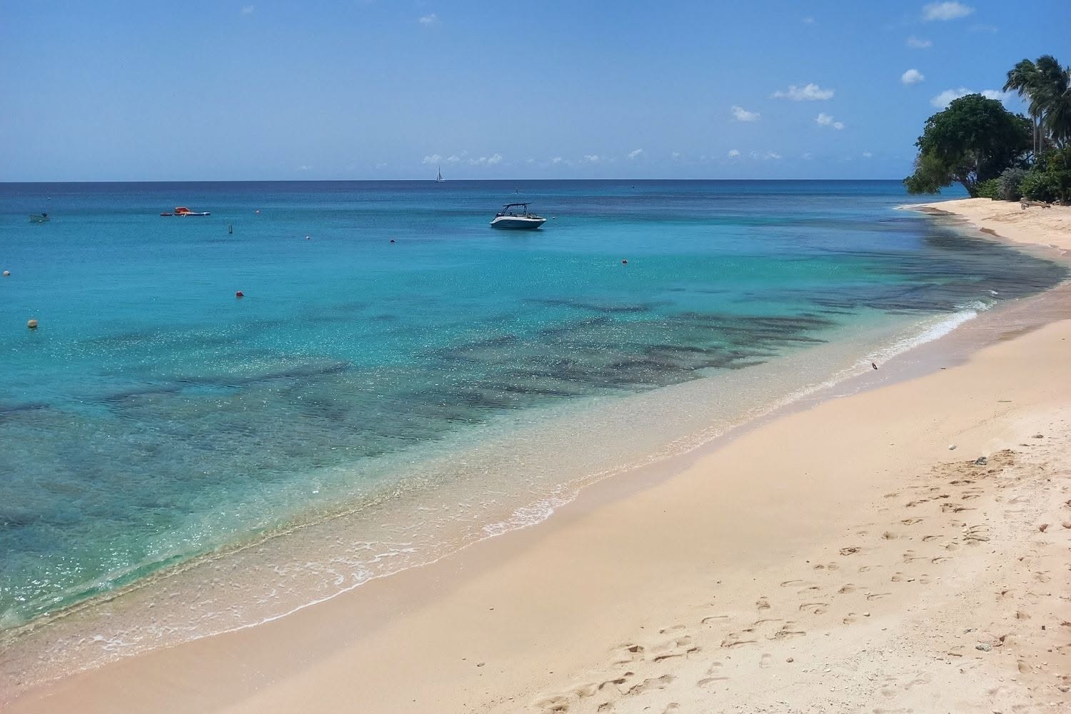 Pale sand and clear Caribbean water at Paynes Bay Beach in Barbados